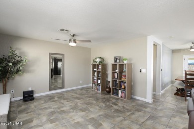 Don't miss the opportunity to own this charming and cozy home on London Bridge Golf Course in Arizona - for sale on GolfHomes.com, golf home, golf lot