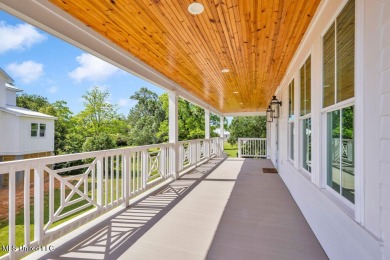 Beautiful home with gorgeous views of the Bay of Saint Louis! on The Bridges Golf Club At Hollywood Casino in Mississippi - for sale on GolfHomes.com, golf home, golf lot
