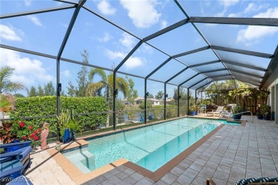 Paradise Found: Immaculate Waterfront Pool Home with TWO MASTER on Royal Tee Country Club in Florida - for sale on GolfHomes.com, golf home, golf lot