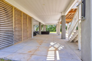 Beautiful home with gorgeous views of the Bay of Saint Louis! on The Bridges Golf Club At Hollywood Casino in Mississippi - for sale on GolfHomes.com, golf home, golf lot