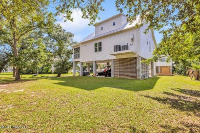 Beautiful home with gorgeous views of the Bay of Saint Louis! on The Bridges Golf Club At Hollywood Casino in Mississippi - for sale on GolfHomes.com, golf home, golf lot