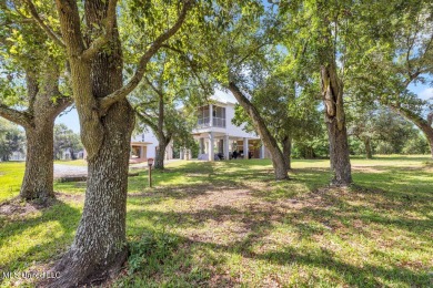 Beautiful home with gorgeous views of the Bay of Saint Louis! on The Bridges Golf Club At Hollywood Casino in Mississippi - for sale on GolfHomes.com, golf home, golf lot
