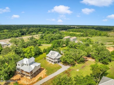 Beautiful home with gorgeous views of the Bay of Saint Louis! on The Bridges Golf Club At Hollywood Casino in Mississippi - for sale on GolfHomes.com, golf home, golf lot