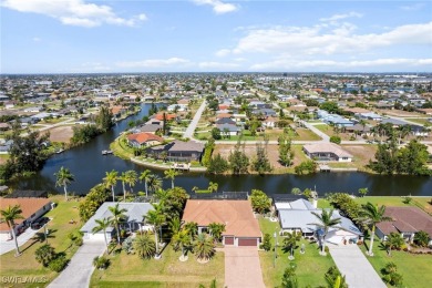 Paradise Found: Immaculate Waterfront Pool Home with TWO MASTER on Royal Tee Country Club in Florida - for sale on GolfHomes.com, golf home, golf lot