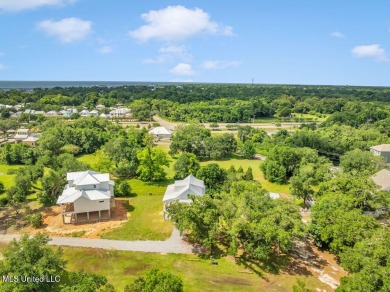 Beautiful home with gorgeous views of the Bay of Saint Louis! on The Bridges Golf Club At Hollywood Casino in Mississippi - for sale on GolfHomes.com, golf home, golf lot