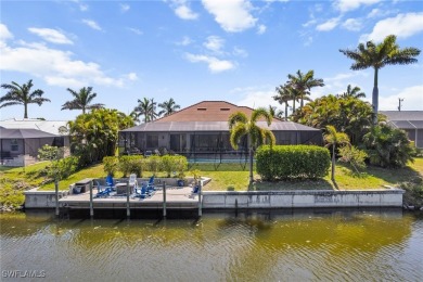 Paradise Found: Immaculate Waterfront Pool Home with TWO MASTER on Royal Tee Country Club in Florida - for sale on GolfHomes.com, golf home, golf lot