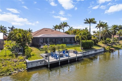 Paradise Found: Immaculate Waterfront Pool Home with TWO MASTER on Royal Tee Country Club in Florida - for sale on GolfHomes.com, golf home, golf lot
