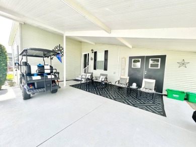 Welcome to this beautifully maintained 3-bedroom, 2-bathroom on Crane Lakes Golf and Country Club in Florida - for sale on GolfHomes.com, golf home, golf lot