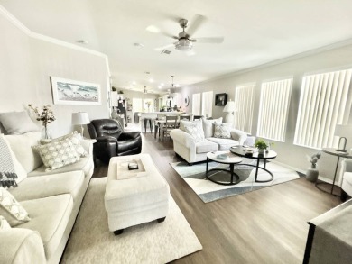 Welcome to this beautifully maintained 3-bedroom, 2-bathroom on Crane Lakes Golf and Country Club in Florida - for sale on GolfHomes.com, golf home, golf lot