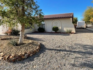 This 3 Bedroom + Den, 2 Bathroom Pool home, is perfectly located on London Bridge Golf Course in Arizona - for sale on GolfHomes.com, golf home, golf lot