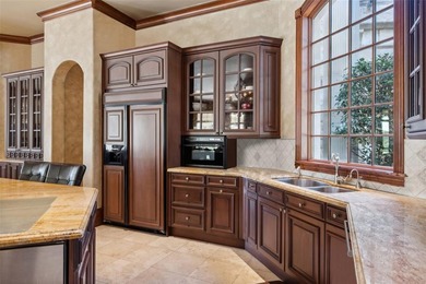 Nestled within the prestigious guard-gated Tour 18 community on Tour 18 Golf Course Dallas in Texas - for sale on GolfHomes.com, golf home, golf lot