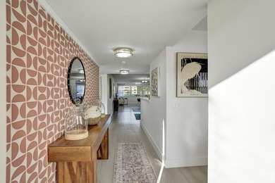 Stunning fully remodeled 1,370 SF first-floor residence blending on Sunrise Lakes Phase IV Golf Course in Florida - for sale on GolfHomes.com, golf home, golf lot