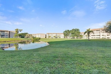 Stunning fully remodeled 1,370 SF first-floor residence blending on Sunrise Lakes Phase IV Golf Course in Florida - for sale on GolfHomes.com, golf home, golf lot