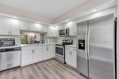 Move-in ready 55+ 2/2.The modern kitchen boasts stainless steel on Flamingo Lakes Country Club in Florida - for sale on GolfHomes.com, golf home, golf lot