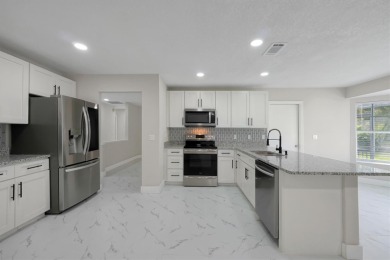 Renovated and Ready for You! This beautifully updated one-story on Wedgefield Golf Club in Florida - for sale on GolfHomes.com, golf home, golf lot