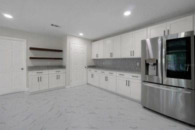 Renovated and Ready for You! This beautifully updated one-story on Wedgefield Golf Club in Florida - for sale on GolfHomes.com, golf home, golf lot