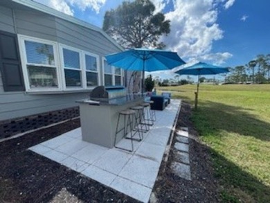 Stunning view from this home on the eleventh tee box of the Golf on Lake Fairways Country Club in Florida - for sale on GolfHomes.com, golf home, golf lot