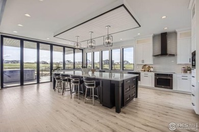 Welcome to elevated Colorado living at its finest. Perched above on Raindance National Golf Course in Colorado - for sale on GolfHomes.com, golf home, golf lot