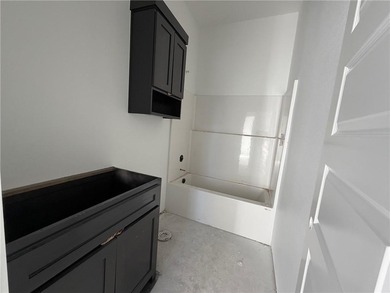 Kitchen has 2cm quartz & marble backsplash, along with stainless on Bella Vista - Metfield Golf Complex and Country Club in Arkansas - for sale on GolfHomes.com, golf home, golf lot