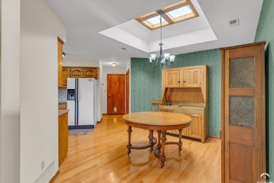 Unique open floor plan.  Living room featuring a vaulted ceiling on Alvamar Country Club in Kansas - for sale on GolfHomes.com, golf home, golf lot