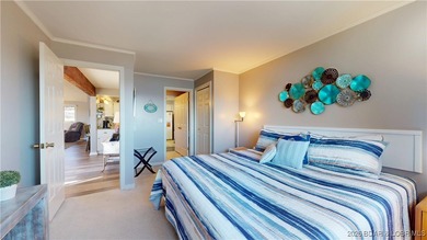 LAKE OF THE OZARKS | TOP-FLOOR CONDOMINIUM Enjoy breathtaking on The Oaks Golf Course in Missouri - for sale on GolfHomes.com, golf home, golf lot