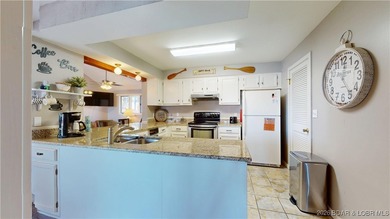 LAKE OF THE OZARKS | TOP-FLOOR CONDOMINIUM Enjoy breathtaking on The Oaks Golf Course in Missouri - for sale on GolfHomes.com, golf home, golf lot