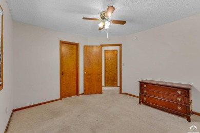 Unique open floor plan.  Living room featuring a vaulted ceiling on Alvamar Country Club in Kansas - for sale on GolfHomes.com, golf home, golf lot