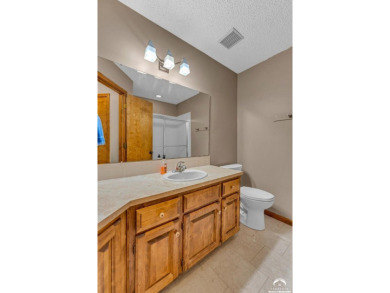 Unique open floor plan.  Living room featuring a vaulted ceiling on Alvamar Country Club in Kansas - for sale on GolfHomes.com, golf home, golf lot