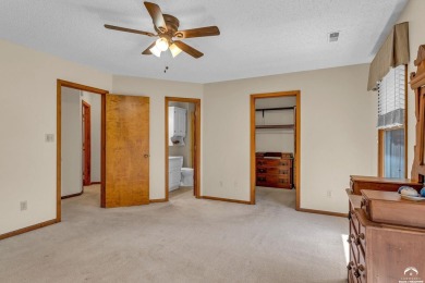 Unique open floor plan.  Living room featuring a vaulted ceiling on Alvamar Country Club in Kansas - for sale on GolfHomes.com, golf home, golf lot