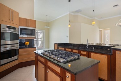 One or more photo(s) has been virtually staged. Tucked within on Boca Royale Golf and Country Club in Florida - for sale on GolfHomes.com, golf home, golf lot