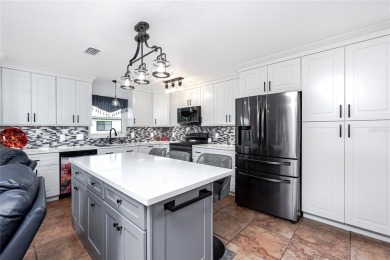 Experience the ultimate Florida lifestyle in this stunning home on Rotonda Golf and Country Club The Palms Course in Florida - for sale on GolfHomes.com, golf home, golf lot
