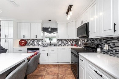 Experience the ultimate Florida lifestyle in this stunning home on Rotonda Golf and Country Club The Palms Course in Florida - for sale on GolfHomes.com, golf home, golf lot