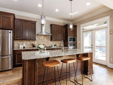 Main Floor Primary & In-Law Suite: Nestled beautifully among the on Heritage Golf Club in North Carolina - for sale on GolfHomes.com, golf home, golf lot