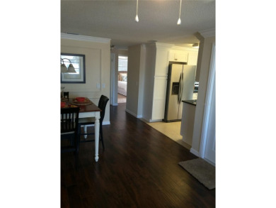 Under contract-accepting backup offers. LOWEST PRICED SFR on Key Royale Club in Florida - for sale on GolfHomes.com, golf home, golf lot