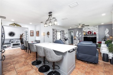 Experience the ultimate Florida lifestyle in this stunning home on Rotonda Golf and Country Club The Palms Course in Florida - for sale on GolfHomes.com, golf home, golf lot