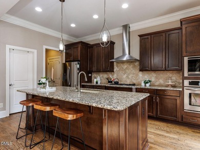 Main Floor Primary & In-Law Suite: Nestled beautifully among the on Heritage Golf Club in North Carolina - for sale on GolfHomes.com, golf home, golf lot