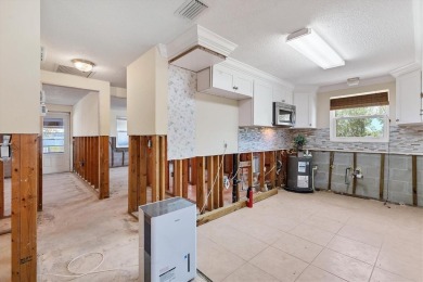 Under contract-accepting backup offers. LOWEST PRICED SFR on Key Royale Club in Florida - for sale on GolfHomes.com, golf home, golf lot