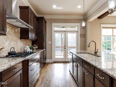 Main Floor Primary & In-Law Suite: Nestled beautifully among the on Heritage Golf Club in North Carolina - for sale on GolfHomes.com, golf home, golf lot