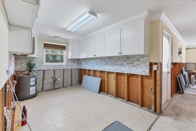 Under contract-accepting backup offers. LOWEST PRICED SFR on Key Royale Club in Florida - for sale on GolfHomes.com, golf home, golf lot