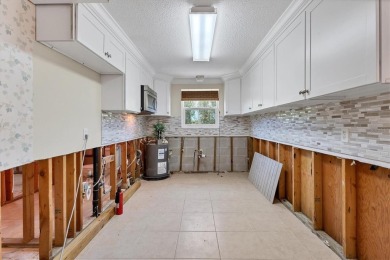 Under contract-accepting backup offers. LOWEST PRICED SFR on Key Royale Club in Florida - for sale on GolfHomes.com, golf home, golf lot