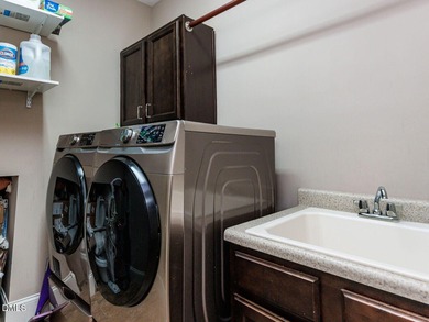 Main Floor Primary & In-Law Suite: Nestled beautifully among the on Heritage Golf Club in North Carolina - for sale on GolfHomes.com, golf home, golf lot