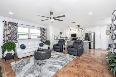 Experience the ultimate Florida lifestyle in this stunning home on Rotonda Golf and Country Club The Palms Course in Florida - for sale on GolfHomes.com, golf home, golf lot