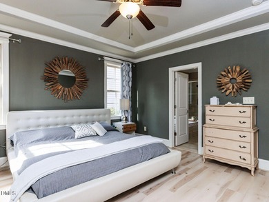 Main Floor Primary & In-Law Suite: Nestled beautifully among the on Heritage Golf Club in North Carolina - for sale on GolfHomes.com, golf home, golf lot