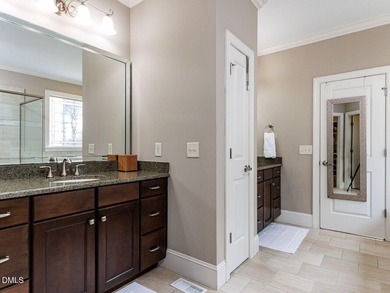 Main Floor Primary & In-Law Suite: Nestled beautifully among the on Heritage Golf Club in North Carolina - for sale on GolfHomes.com, golf home, golf lot