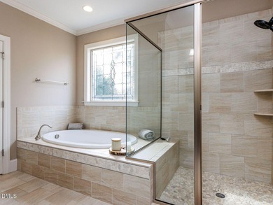 Main Floor Primary & In-Law Suite: Nestled beautifully among the on Heritage Golf Club in North Carolina - for sale on GolfHomes.com, golf home, golf lot