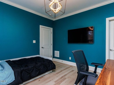 Main Floor Primary & In-Law Suite: Nestled beautifully among the on Heritage Golf Club in North Carolina - for sale on GolfHomes.com, golf home, golf lot