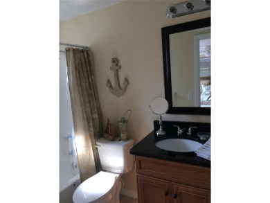 Under contract-accepting backup offers. LOWEST PRICED SFR on Key Royale Club in Florida - for sale on GolfHomes.com, golf home, golf lot