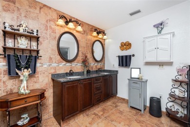Experience the ultimate Florida lifestyle in this stunning home on Rotonda Golf and Country Club The Palms Course in Florida - for sale on GolfHomes.com, golf home, golf lot