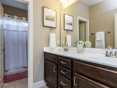 Main Floor Primary & In-Law Suite: Nestled beautifully among the on Heritage Golf Club in North Carolina - for sale on GolfHomes.com, golf home, golf lot