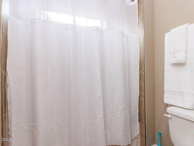 Main Floor Primary & In-Law Suite: Nestled beautifully among the on Heritage Golf Club in North Carolina - for sale on GolfHomes.com, golf home, golf lot